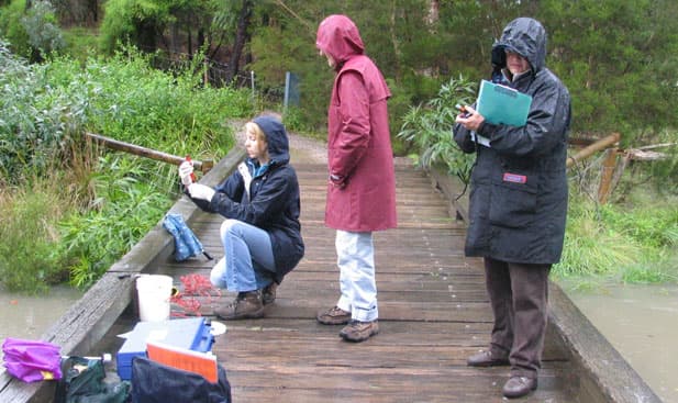 Community members testing water quality at Blackburn Lake